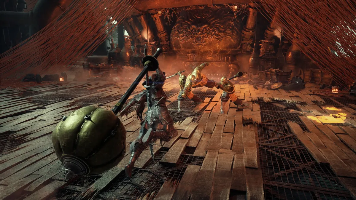 A large spherical weapon fills the foreground of a red-curtained room in Phantom Blade Zero.