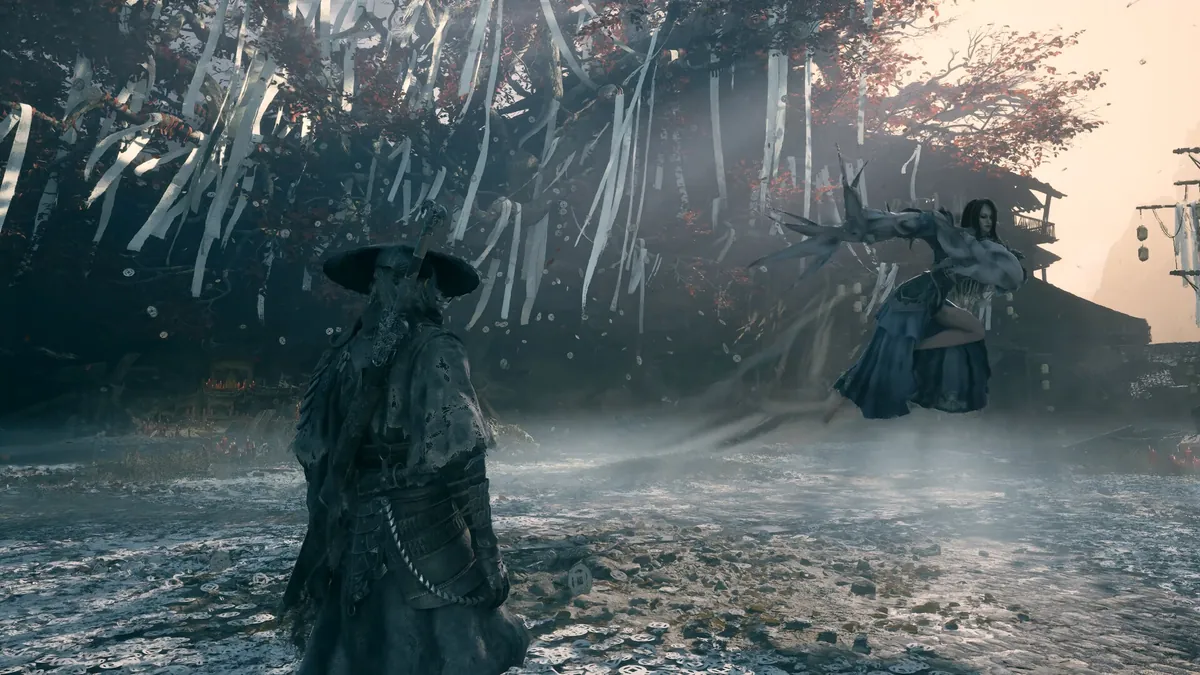 A cloaked warrior faces a suspended figure beneath a paper-strung tree in Phantom Blade Zero.