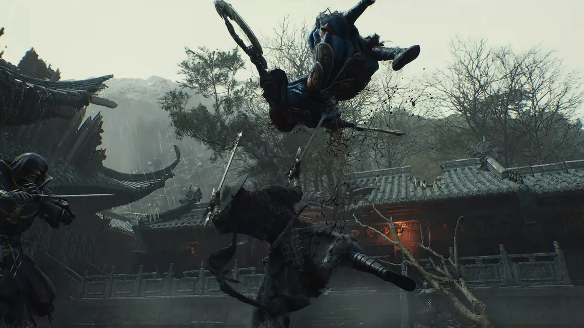A swordsman faces an airborne opponent in a stone courtyard in Phantom Blade Zero.